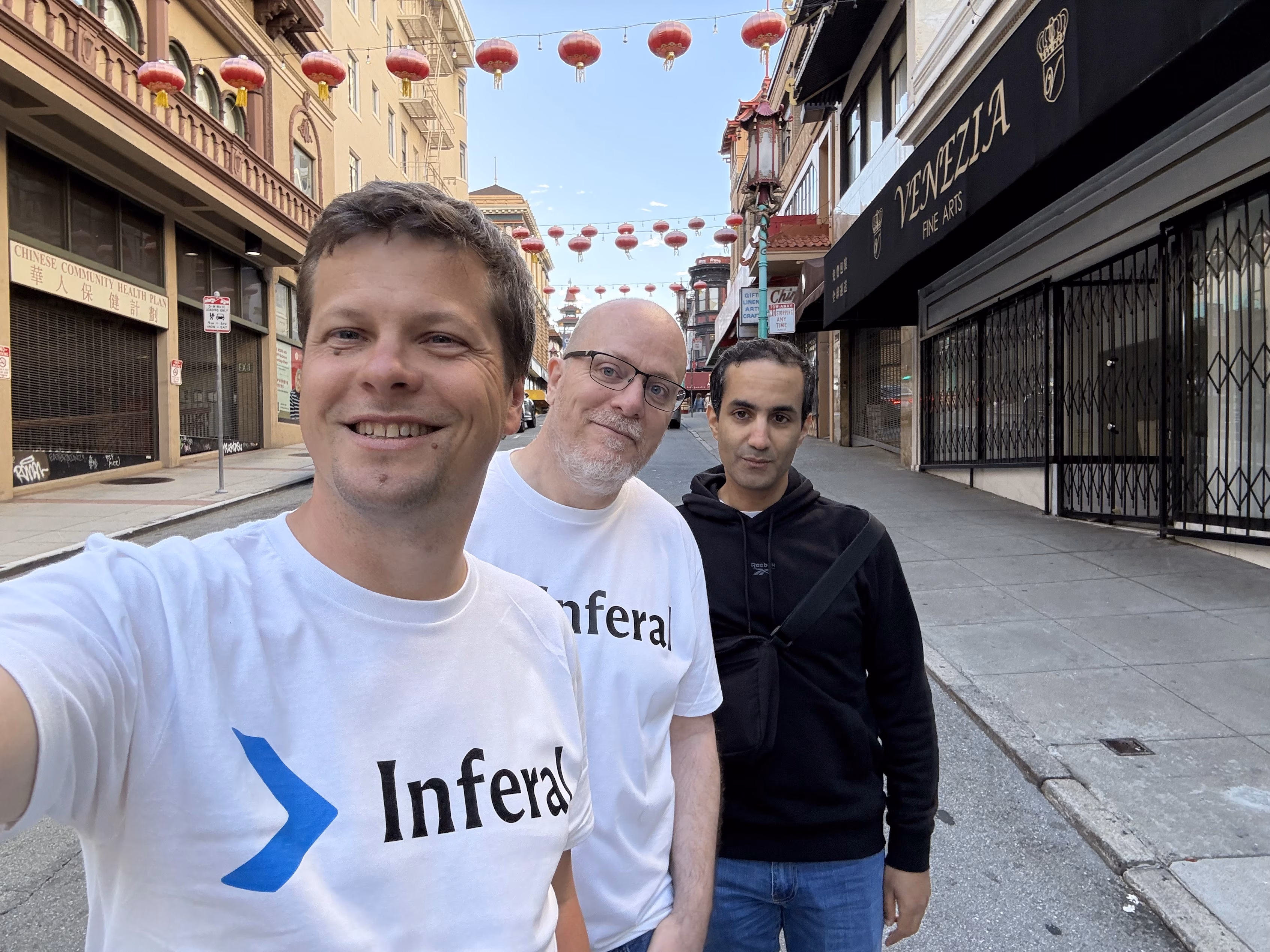 Yurii Rashkovskii, Jeremy Tregunna, and Mehdi Akiki on a lantern-lined street in San Francisco